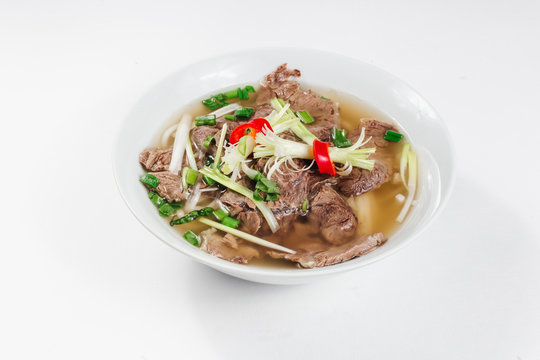 Traditional oriental cuisine of  Vietnam. Pho bo soup with rice noodles, beef, pepper, wheat germ, greens