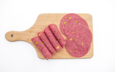  salami on a wooden on background. Slices of salami. Isolated on a white background. cooked boiled ham sausage.