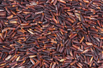 Heap of black rice as background, healthy gluten free food concept