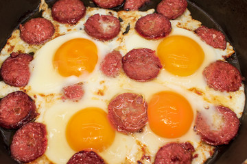 Turkish Sausage (sucuk) and egg. Turkish sausage and egg in pan on white background