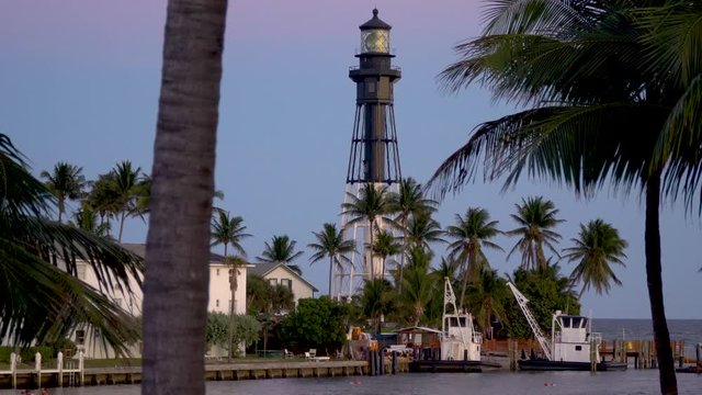 Light house at light house point florida and Hillsboro inlet. Light house and palm trees.