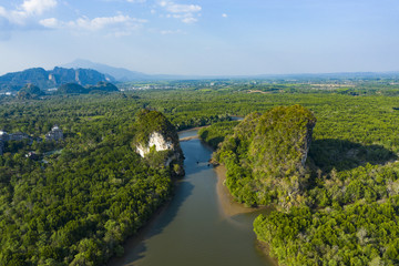 View from above, stunning aerial view of Khao Khanap Nam in Krabi town, Thailand. Khao Khanap Nam are two 100-meters tall limestone mountains jutting out of the Krabi River.