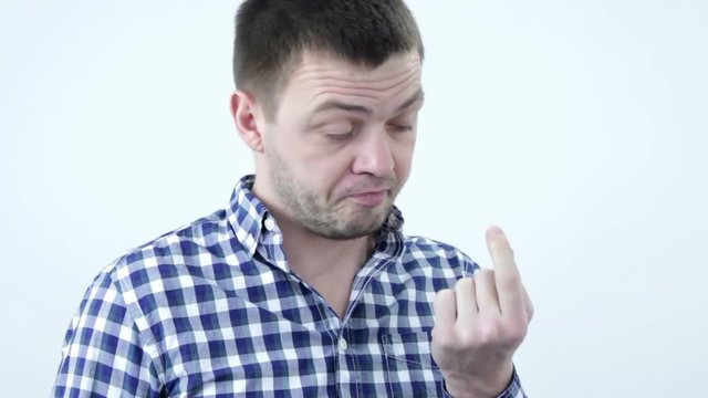 Young man is picking his nose