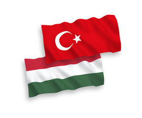 National vector fabric wave flags of Turkey and Hungary isolated on white background. 1 to 2 proportion.