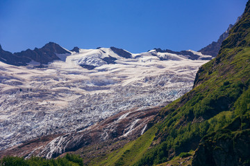 Huge mountain glacier in the surroundings of Dombai. Caucasus Mountains summer, clear day.