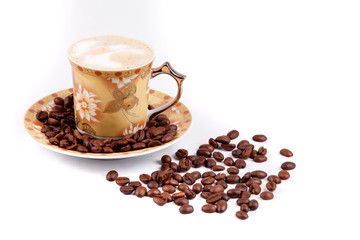cup of coffee with grains on a white background
