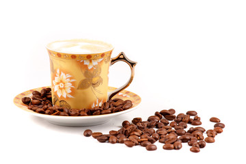 cup of coffee with grains on a white background