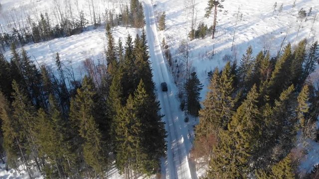 Car driving on a winter road in Trysil, Norway.