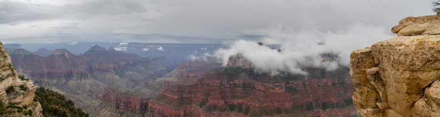 Large panoramic view on Grand Canyon under heavy fog