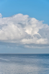 Naklejka na ściany i meble Clouds Over the Southern Mediterranean Sea on the Italian Coast