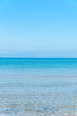 Obraz premium Clear Turquoise Blue Water at a Southern Mediterranean Beach in Italy