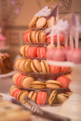 Candy bar with delicious sweets, chocolate candies, macaron tower and other