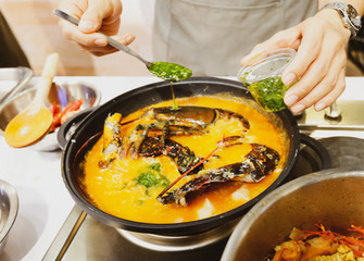Chef cooking food in the kitchen, Traditional Spanish paella