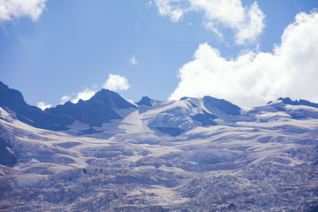 Fototapeta na wymiar Huge mountain glacier in the surroundings of Dombai. Caucasus Mountains summer, clear day.