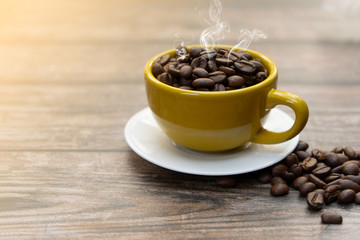 Yellow cup of hot coffee.