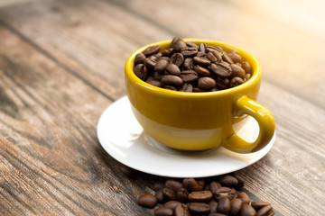 Yellow cup of hot coffee.