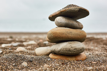 Fototapeta na wymiar Relaxing on the beach, stack of stones