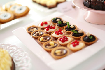Delicious cakes on table. Selective focus
