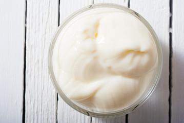 creme fraiche on white wood table background