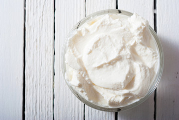 yogurt on white wooden table background