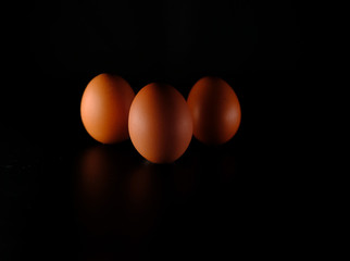 Three eggs on black