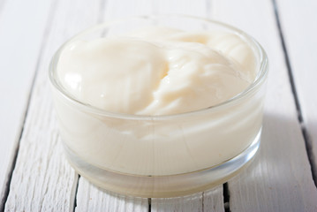 creme fraiche on white wood table background