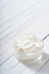 yogurt on white wooden table background