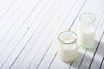 milk samples on white wood table