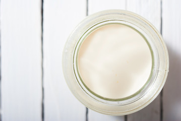 goat milk on white wooden table