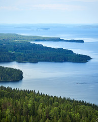 Scenic summer landscape view over the lake Pielinen from the top of the UkkoKoli, a fell at the Koli national park in Joensuu, Finland, the land of a thousand lakes.
