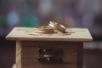 Wedding rings on wooden box , Very shallow focus