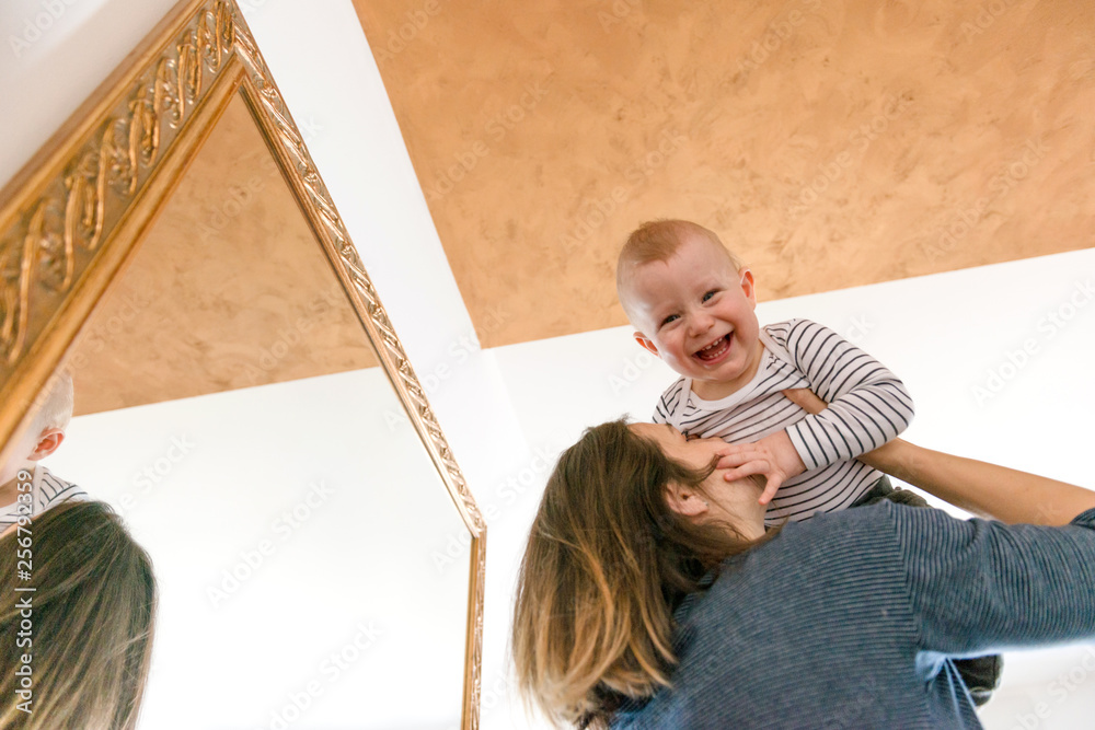 Poster Mother playing with baby boy