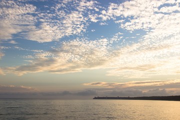Naklejka na ściany i meble Tranquil sunset over the sea