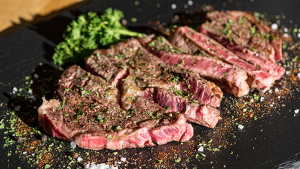 Grilled flat iron steak shot in flat lay style