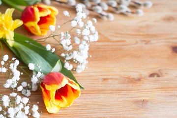 Spring easter flowers decoration on wooden background with free space
