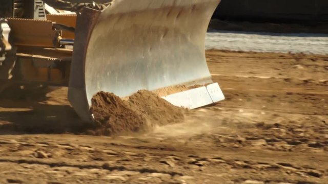 Bulldozer Pushing Dirt on Construction Site - Close Up