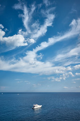 Scenic seascape with a lonely boat, travel concept.