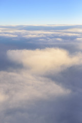 The blue skyline with cloudy in sunrise time, view from window on the plane.
