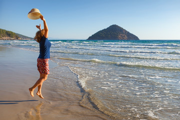 Cheerful girl enjoying on your holiday in Greece on Thasos island