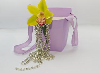 beautiful yellow orchid in a lilac basket