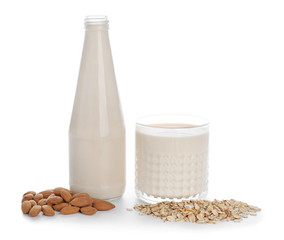 Assortment of tasty vegan milk on white background