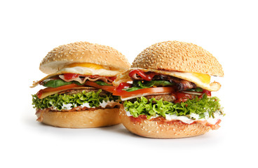 Tasty burgers on white background