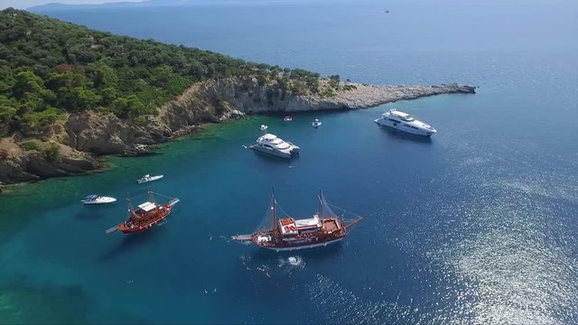 Drone shot of an island and ship made in Greece.