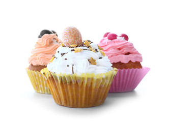 Tasty Easter cupcakes on white background