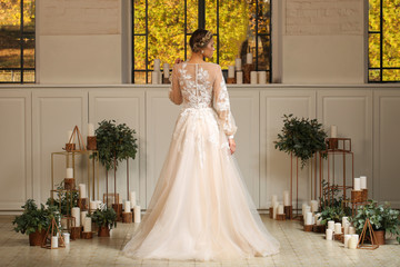Fototapeta premium Beautiful blonde model posing in luxury wedding dress