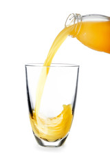 Pouring of tasty orange juice in glass on white background