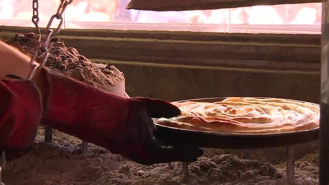 Baking Burek with meat in a traditional pastry shop in Bascarsija in Sarajevo, Bosnia