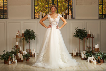 Fototapeta premium Beautiful blonde model posing in luxury wedding dress