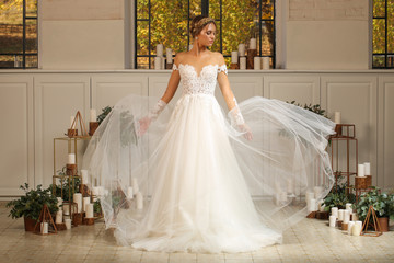 Fototapeta premium Beautiful blonde model posing in luxury wedding dress