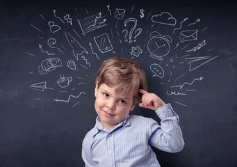 Smart little kid in front of a drawn up blackboard ruminate